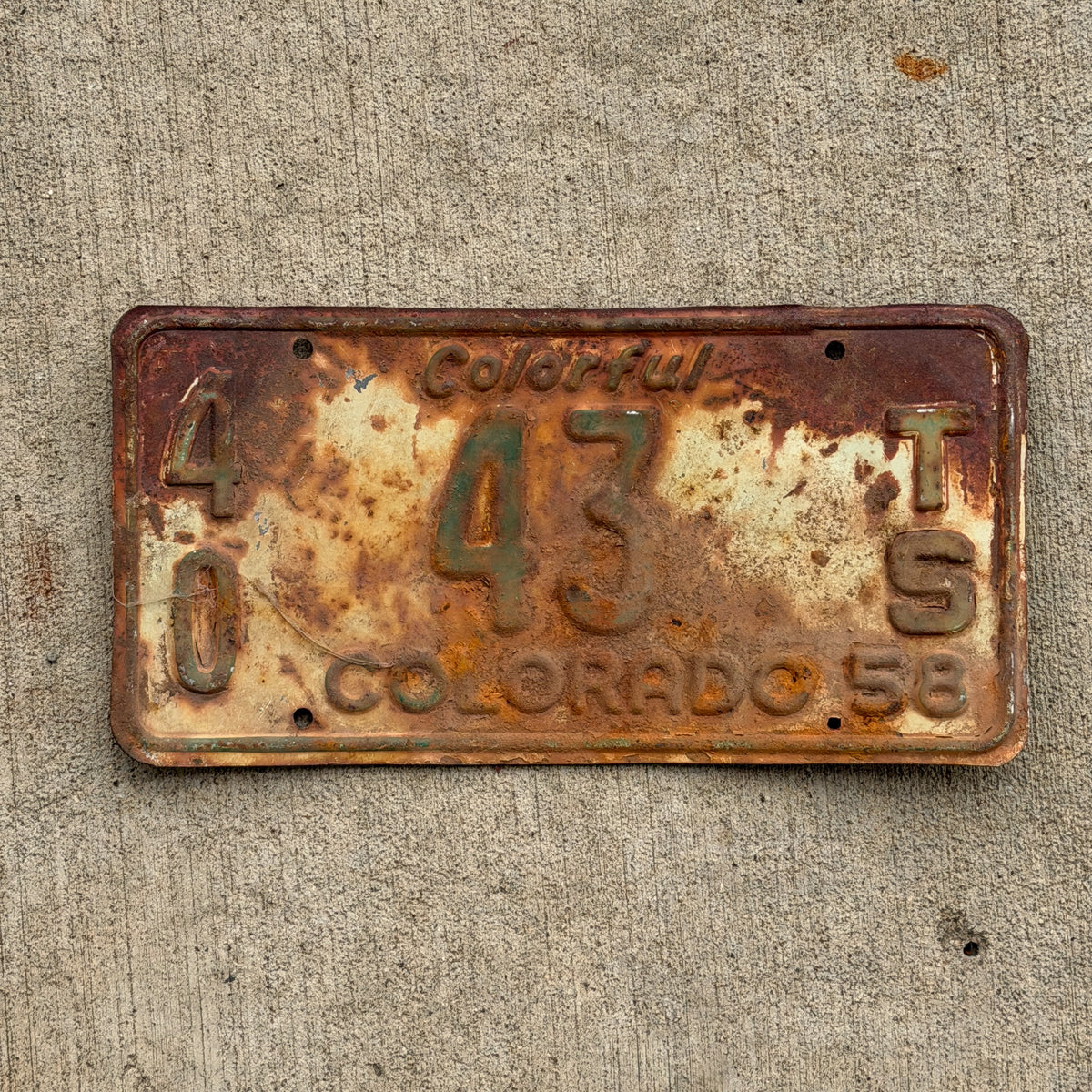 Photo of a 1958 Colorado Tractor License Plate Auto Tag Garage Decor Vintage 40 43 TS with original patina