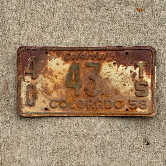 Photo of a 1958 Colorado Tractor License Plate Auto Tag Garage Decor Vintage 40 43 TS with original patina