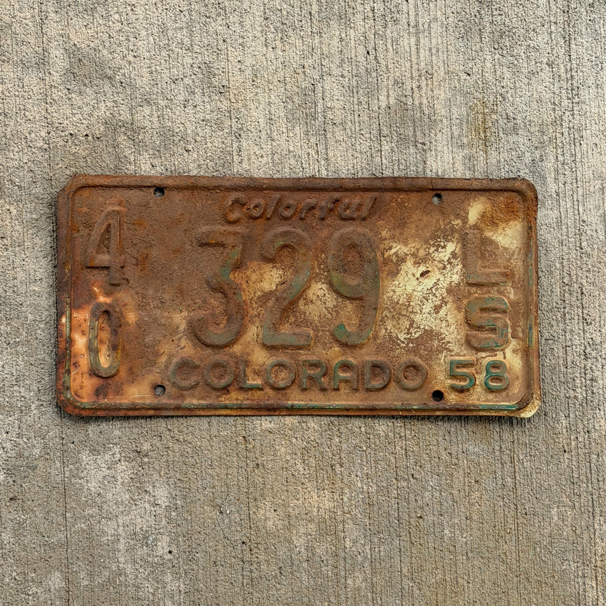 Photo of a 1958 Colorado Trailer License Plate Auto Tag Garage Decor Vintage 40 329 LS with original patina