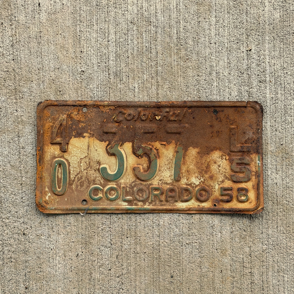 Photo of a 1958 Colorado Trailer License Plate Auto Tag Garage Decor Vintage 40 357 LS with original patina