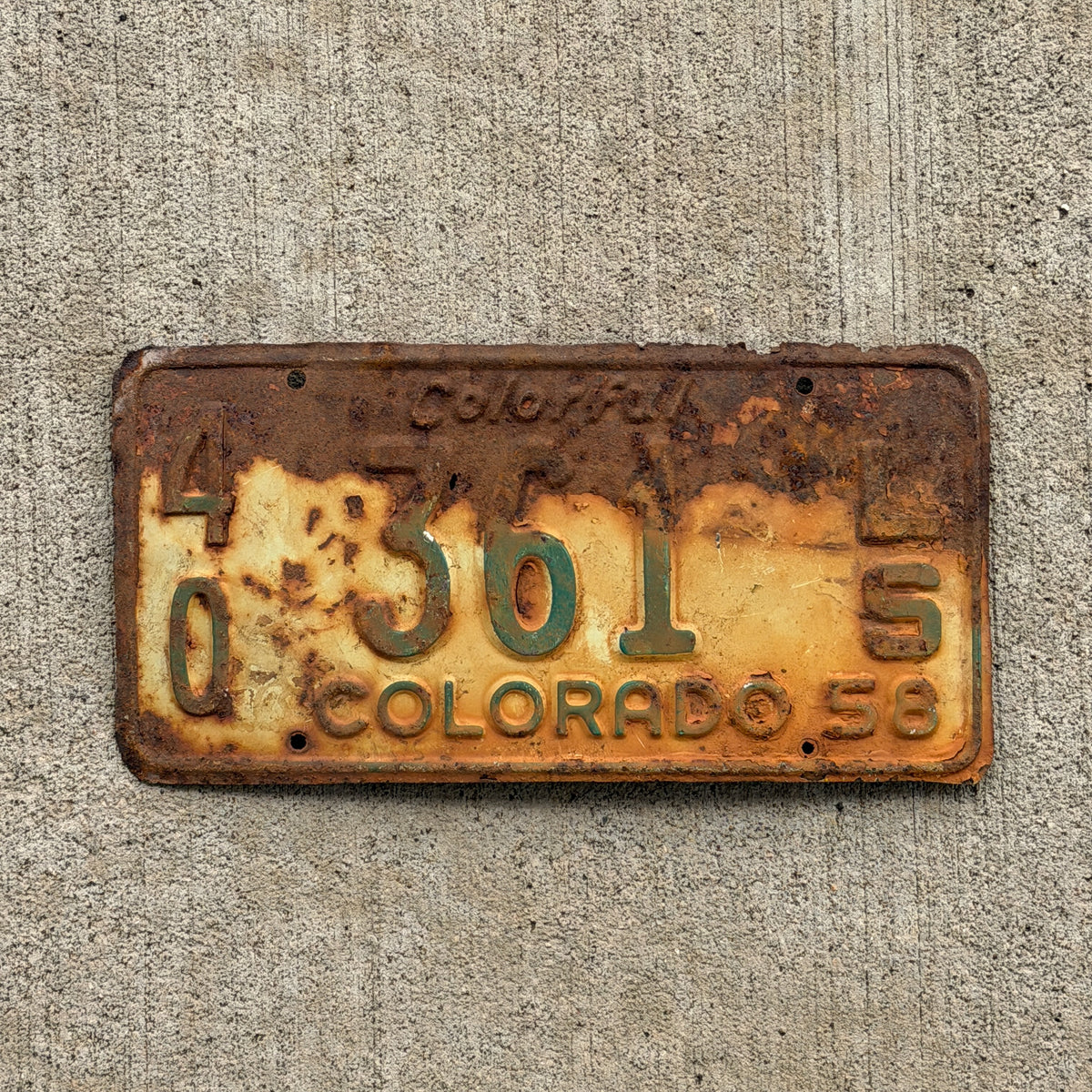 Photo of a 1958 Colorado Trailer License Plate Auto Tag Garage Decor Vintage 40 361 LS with original patina