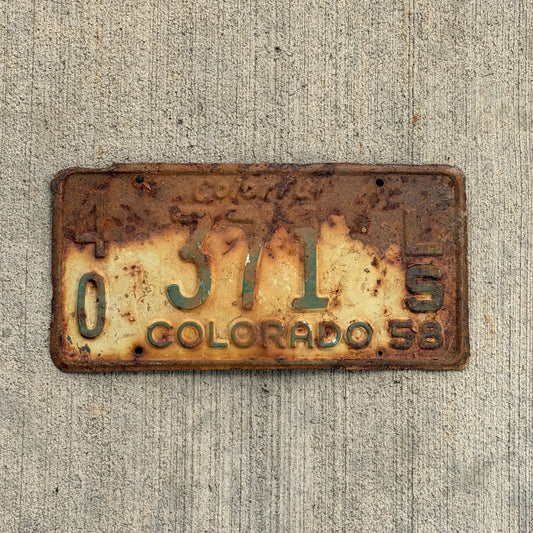 Photo of a 1958 Colorado Trailer License Plate Auto Tag Garage Decor Vintage 40 371 LS with original patina