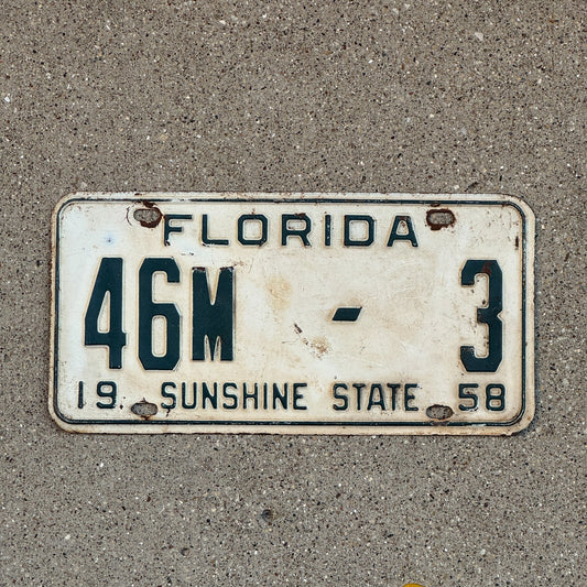 Photo of a 1958 Florida Dealer License Plate Auto Tag Garage Decor Vintage Jefferson County 46 M 3 with original patina