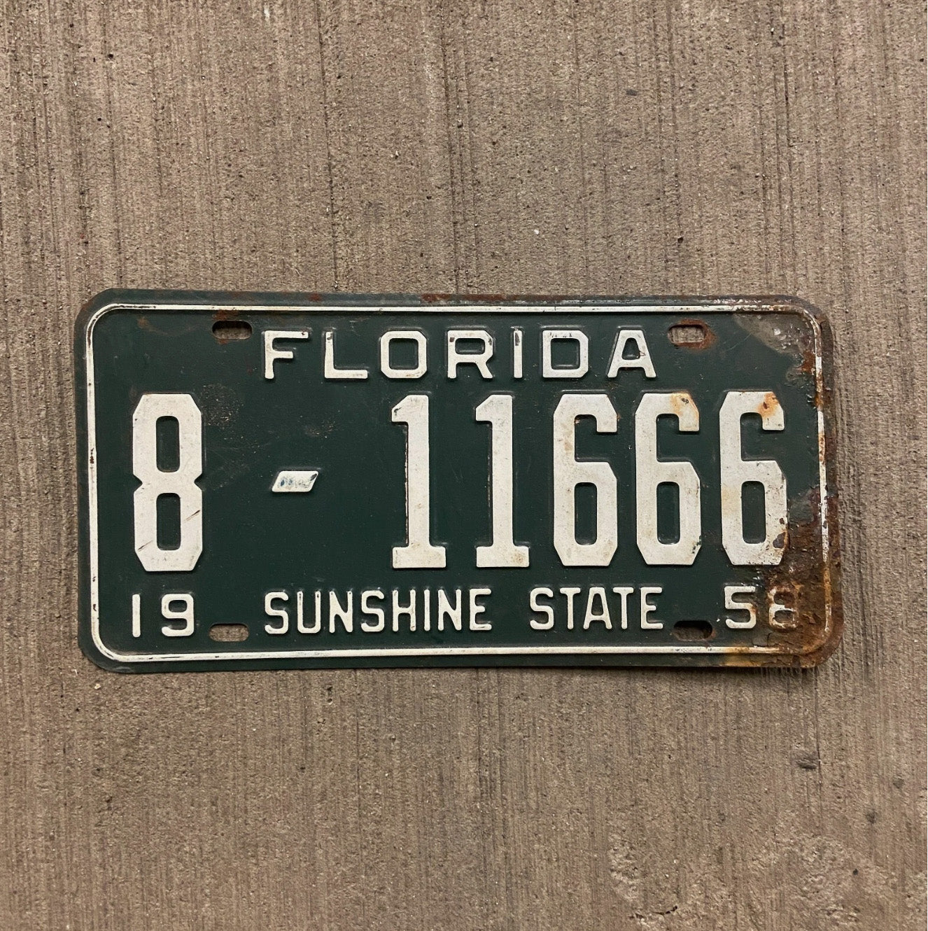 Photo of a 1958 Florida License Plate Auto Tag Garage Decor Vintage Full House 666 Devil Evil 8 11666 with original patina