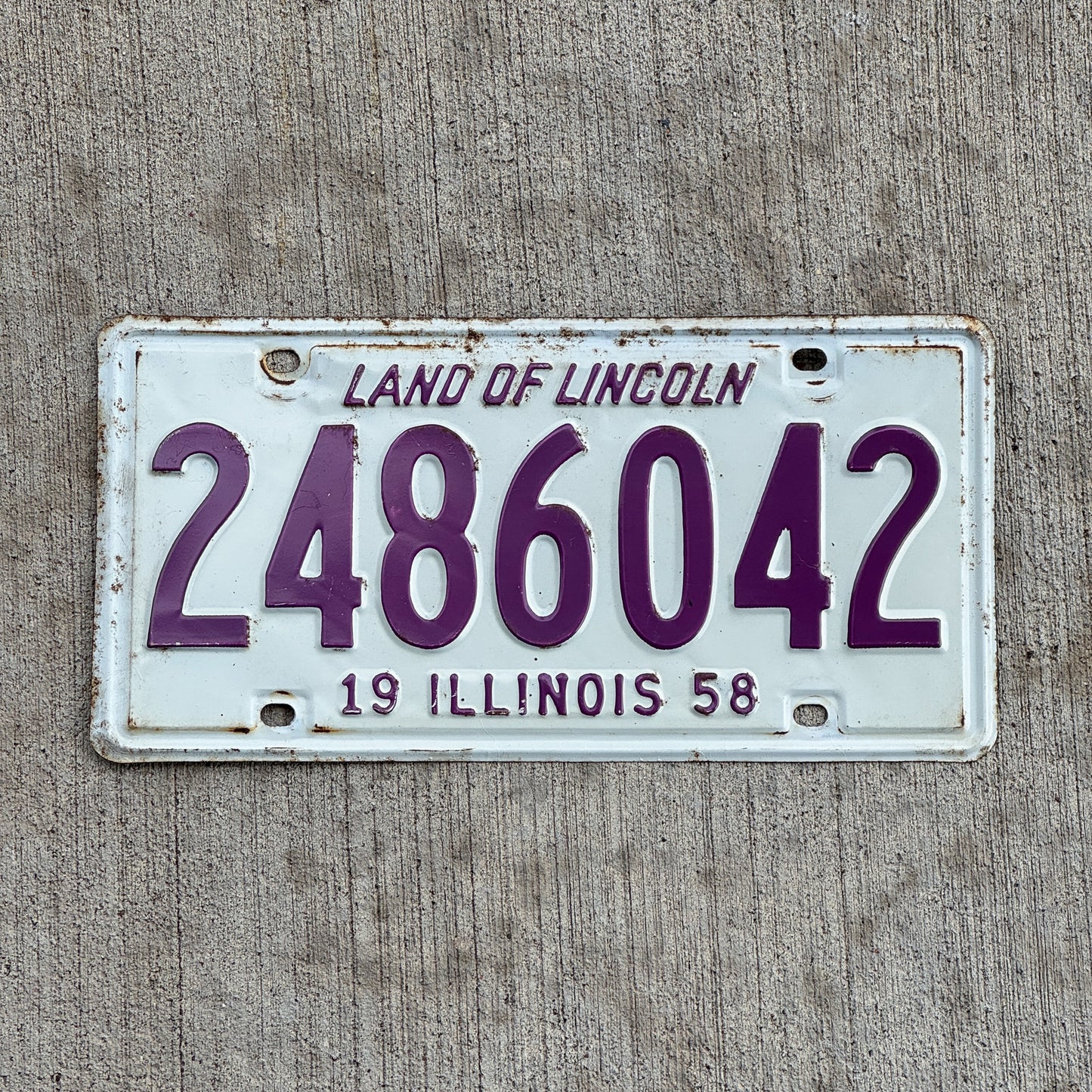 Photo of a 1958 Illinois License Plate Auto Tag Garage Decor Vintage 2 486 042 with original patina