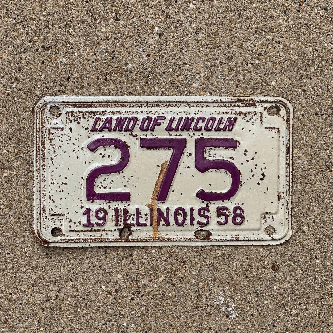 Photo of a 1958 Illinois Motorcycle License Plate Auto Tag Garage Decor Vintage Low Number Three Digit 275 with original patina