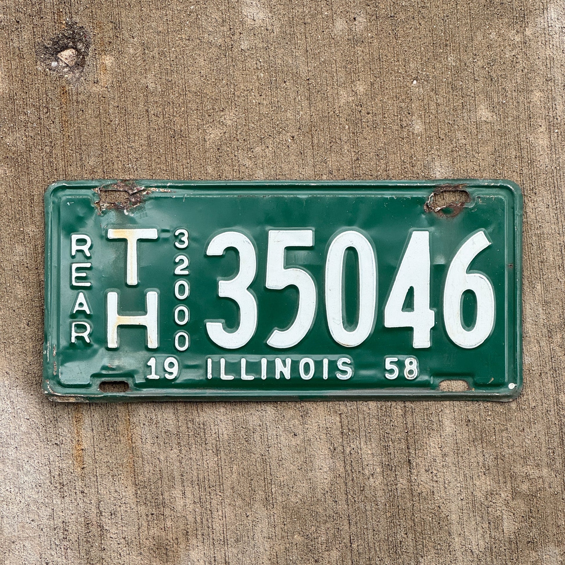 Photo of a 1958 Illinois Truck Mileage Tax License Plate Auto Tag Garage Decor Vintage TH 35046 with original patina