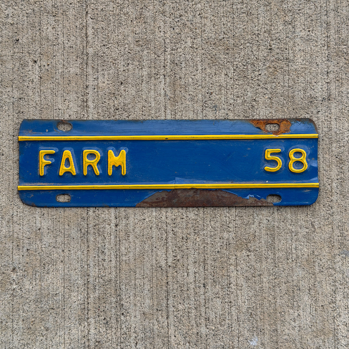 Photo of a 1958 Kansas Farm Truck License Plate Auto Tag Garage Decor Vintage Supplementary Topper with original patina