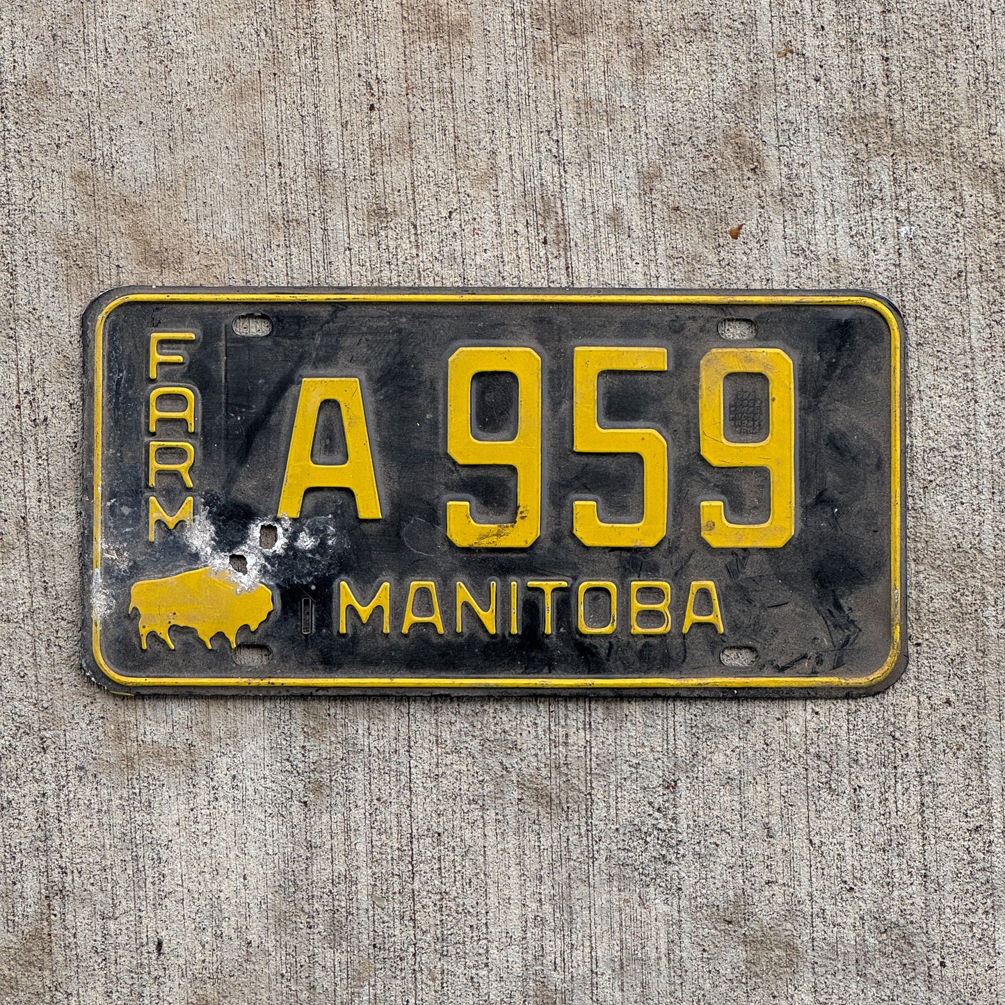 Photo of a 1958 Manitoba Farm Truck License Plate Auto Tag Garage Decor Vintage Buffalo Bison A 959 with original patina