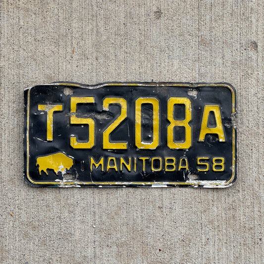 Photo of a 1958 Manitoba Truck License Plate Auto Tag Garage Decor Vintage Buffalo Bison T 5208 A with original patina