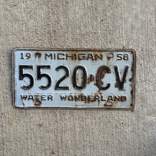 Photo of a 1958 Michigan Commercial License Plate Auto Tag Garage Decor Vintage 5520 CV with original patina