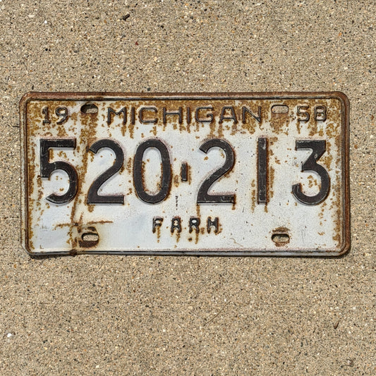 Photo of a 1958 Michigan Farm License Plate Auto Tag Garage Decor Vintage 520 213 with original patina