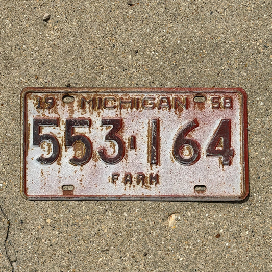 Photo of a 1958 Michigan Farm License Plate Auto Tag Garage Decor Vintage 553 164 with original patina