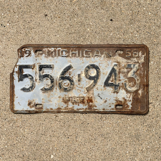 Photo of a 1958 Michigan Farm License Plate Auto Tag Garage Decor Vintage 556 943 with original patina
