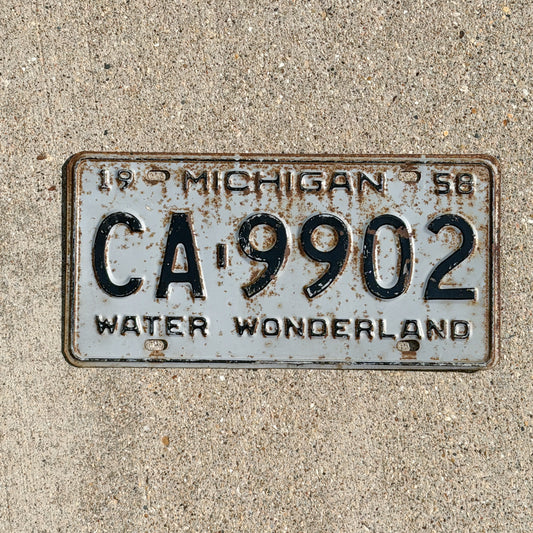 Photo of a 1958 Michigan License Plate Auto Tag Garage Decor Vintage CA 9902 with original patina