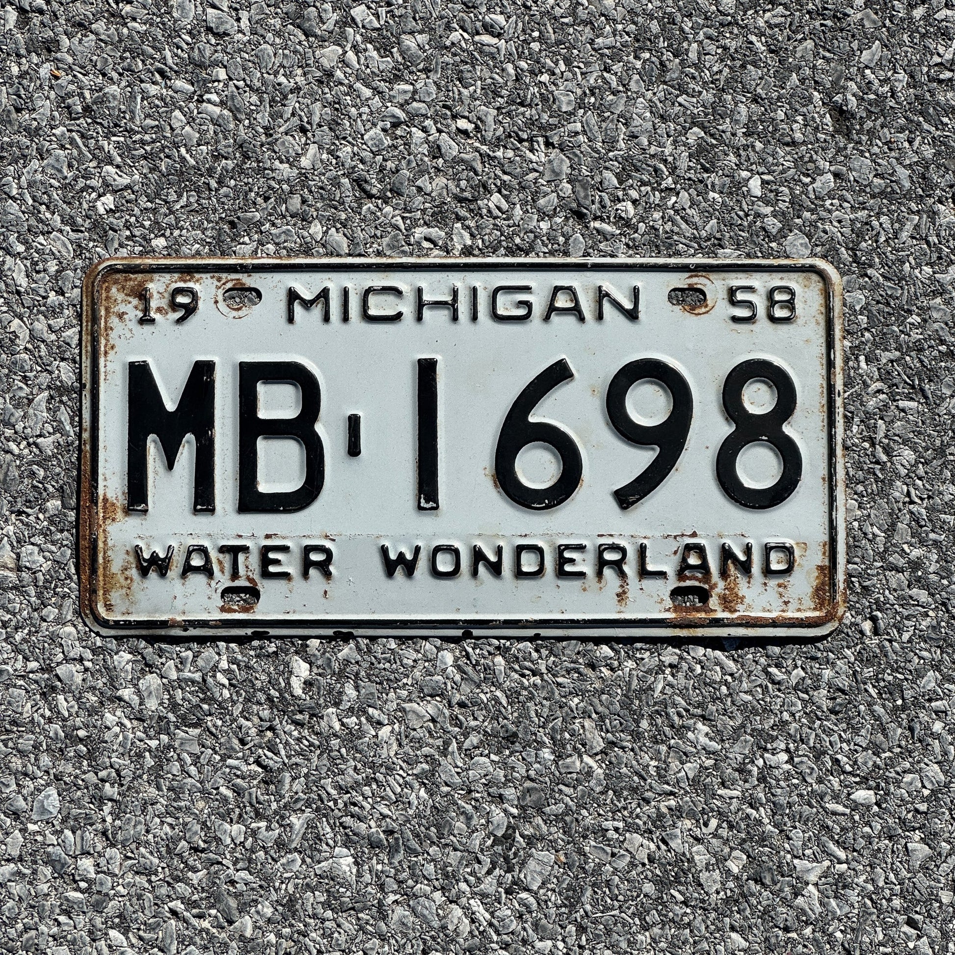 Photo of a 1958 Michigan License Plate Auto Tag Garage Decor Vintage MB 1698