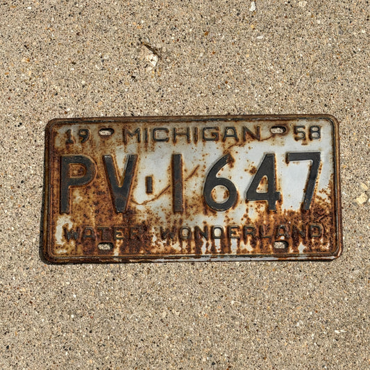 Photo of a 1958 Michigan License Plate Auto Tag Garage Decor Vintage PV 1647 with original patina