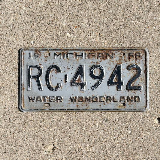 Photo of a 1958 Michigan License Plate Auto Tag Garage Decor Vintage RC 4942 with original patina