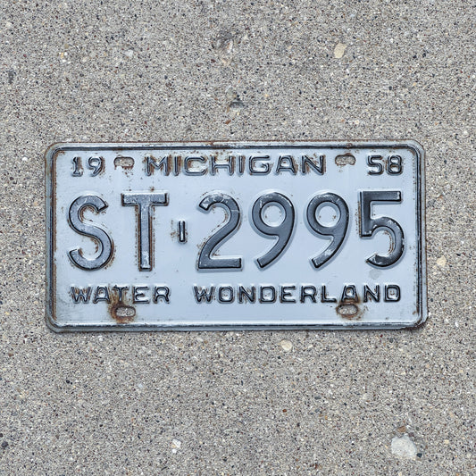 Photo of a 1958 Michigan License Plate Auto Tag Garage Decor Vintage ST 2995 with original patina