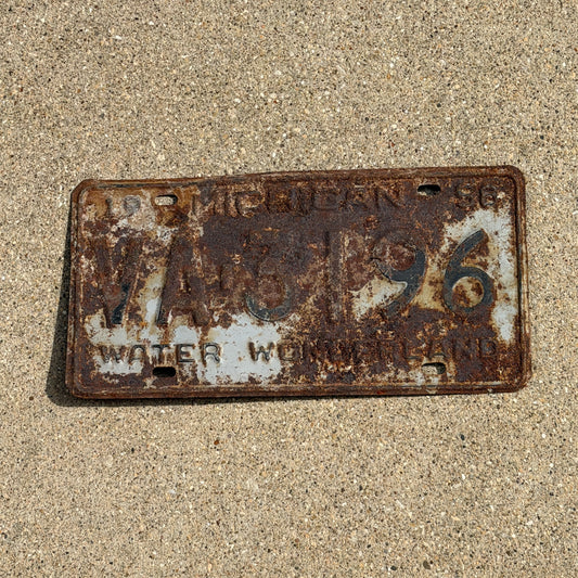 Photo of a 1958 Michigan License Plate Auto Tag Garage Decor Vintage VA 3196 with original patina