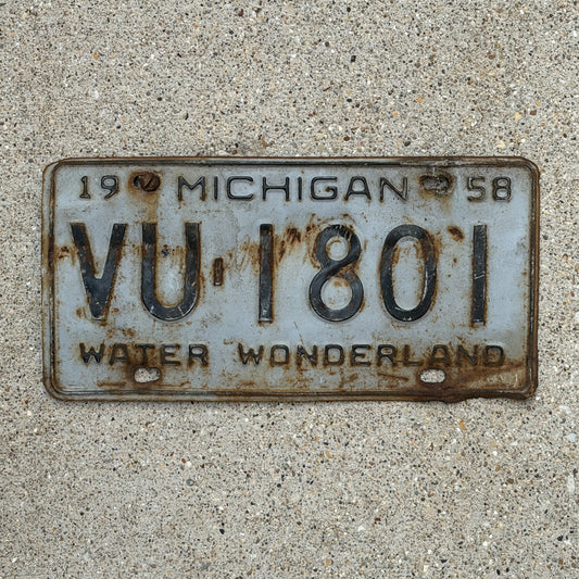 Photo of a 1958 Michigan License Plate Auto Tag Garage Decor Vintage VU 1801 with original patina