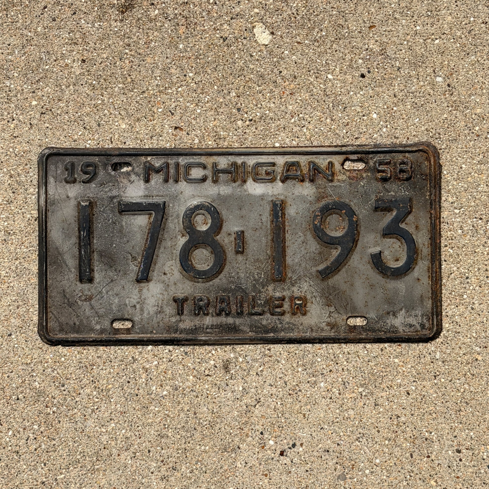 Photo of a 1958 Michigan Trailer License Plate Auto Tag Garage Decor Vintage 178 193 with original patina