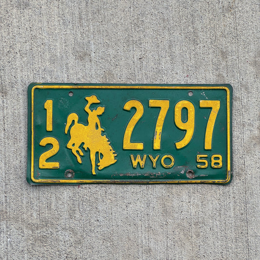Photo of a 1958 Wyoming License Plate Auto Tag Garage Decor Vintage Cowboy Rodeo 12 2797 with original patina