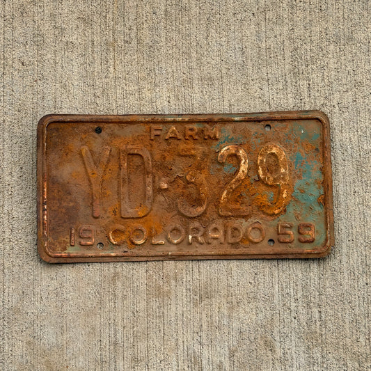 Photo of a 1959 Colorado Farm Truck License Plate Auto Tag 1 Vintage YD 329 with original patina
