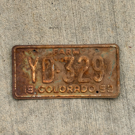 Photo of a 1959 Colorado Farm Truck License Plate Auto Tag 2 Vintage YD 329 with original patina