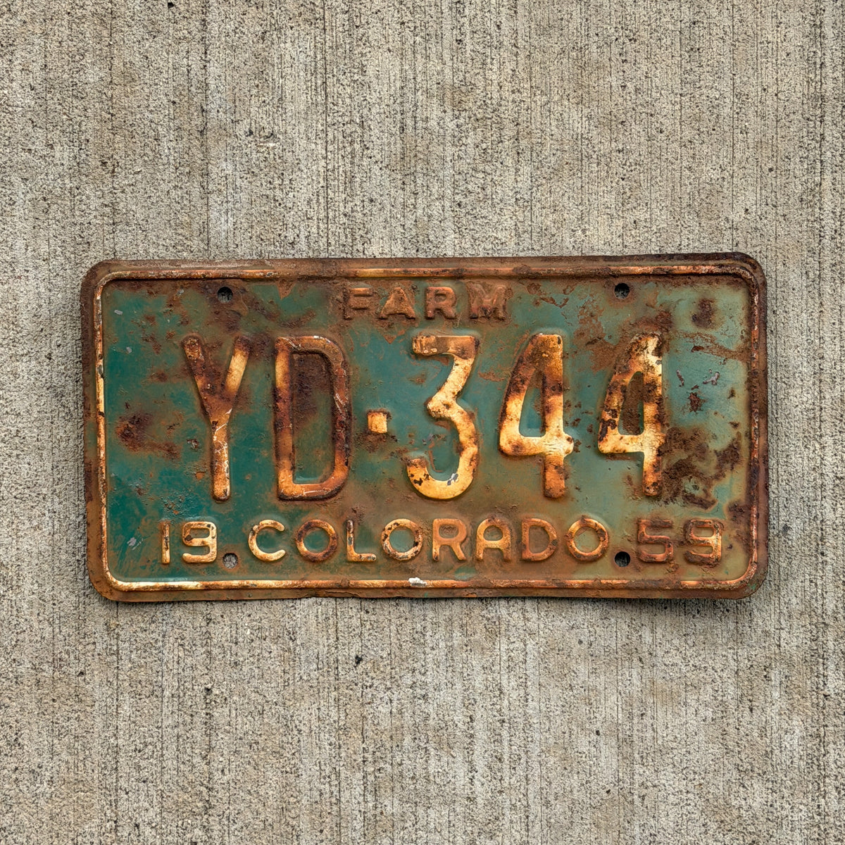 Photo of a 1959 Colorado Farm Truck License Plate Auto Tag Garage Decor Vintage YD 344 with original patina