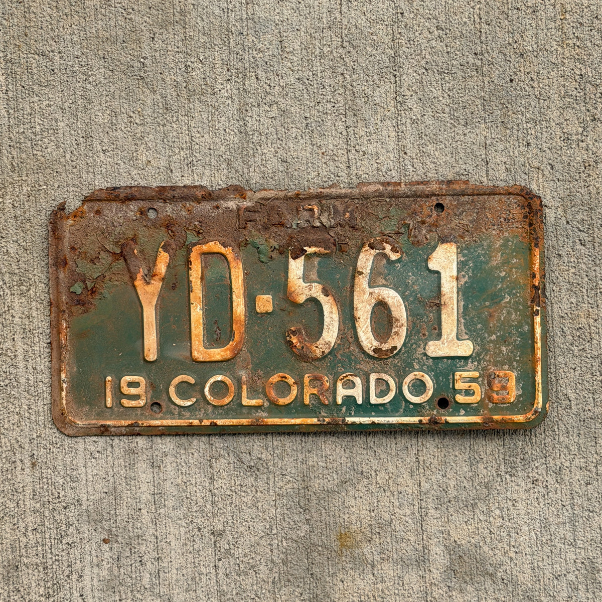 Photo of a 1959 Colorado Farm Truck License Plate Auto Tag Garage Decor Vintage YD 561 with original patina