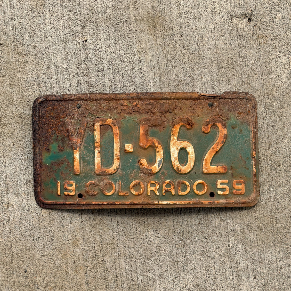 Photo of a 1959 Colorado Farm Truck License Plate Auto Tag Garage Decor Vintage YD 562 with original patina
