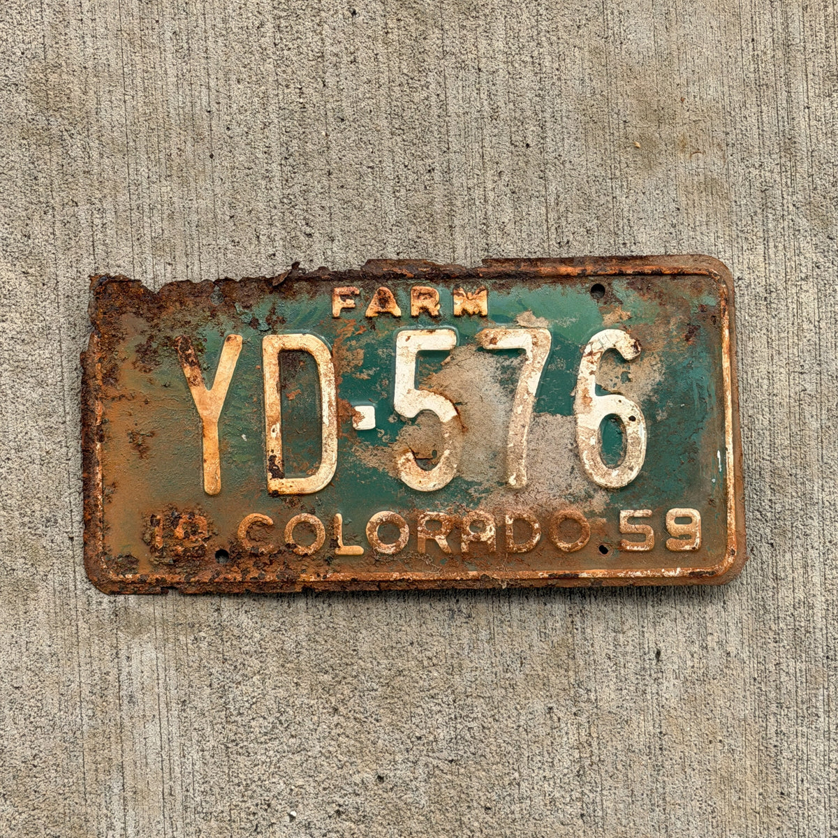 Photo of a 1959 Colorado Farm Truck License Plate Auto Tag Garage Decor Vintage YD 576 with original patina