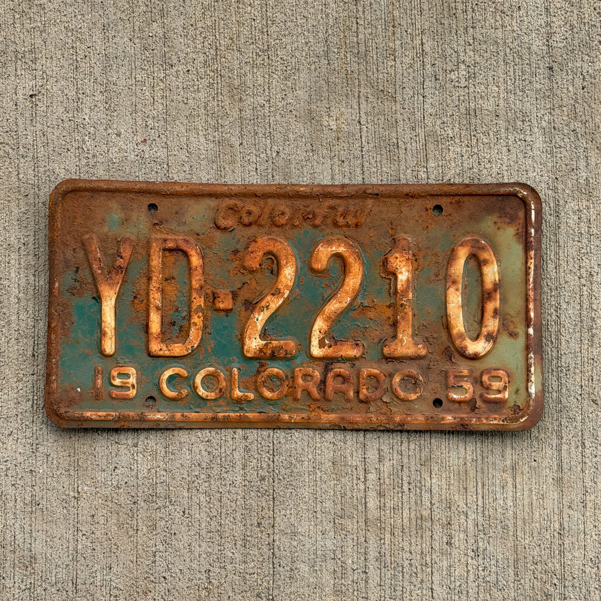 Photo of a 1959 Colorado License Plate Auto Tag Garage Decor Vintage YD 2210 with original patina