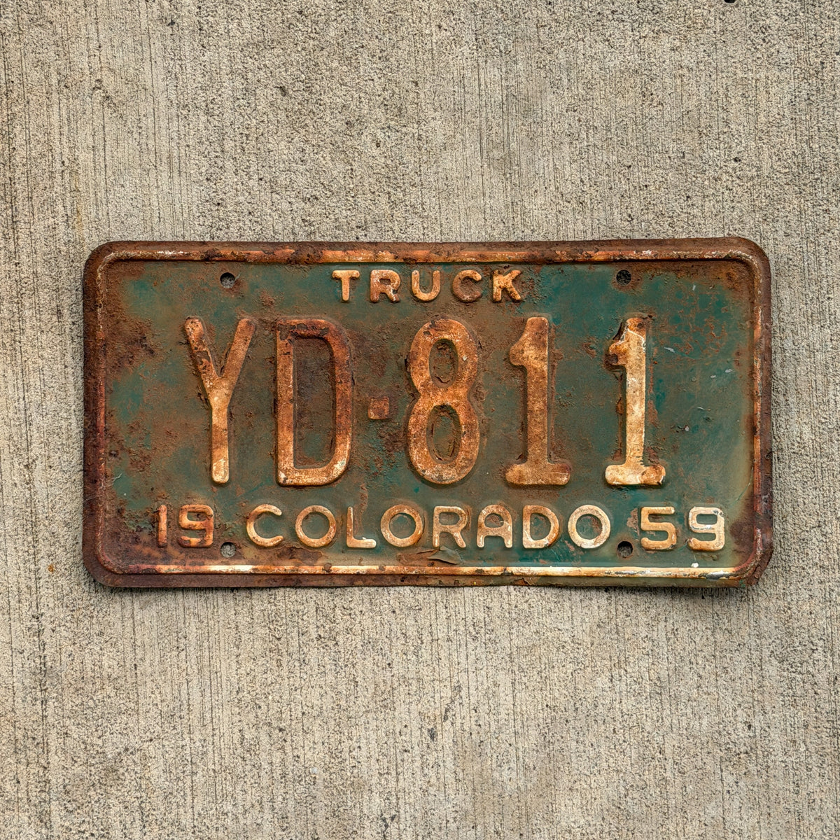 Photo of a 1959 Colorado Truck License Plate Auto Tag Garage Decor Vintage YD 811 with original patina