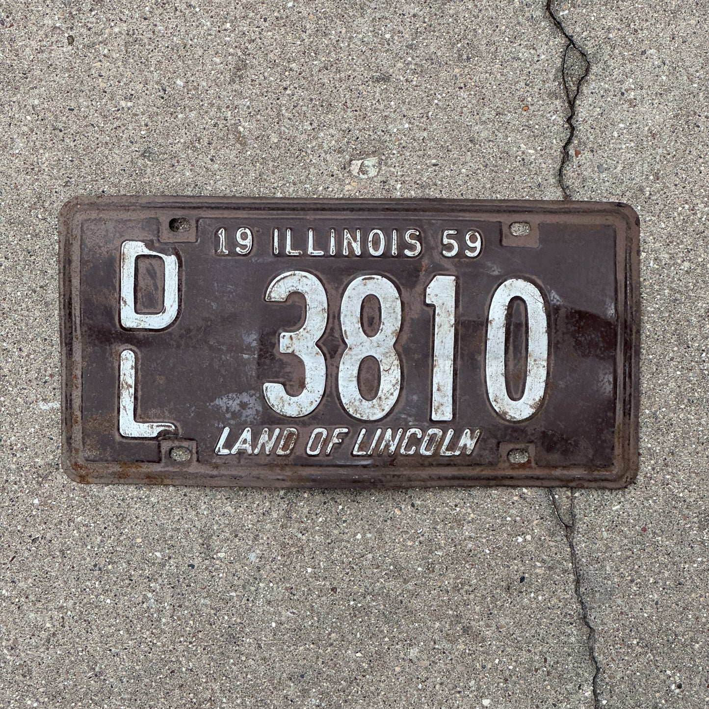 Photo of a 1959 Illinois Dealer License Plate Auto Tag Garage Decor Vintage 3810 with original patina