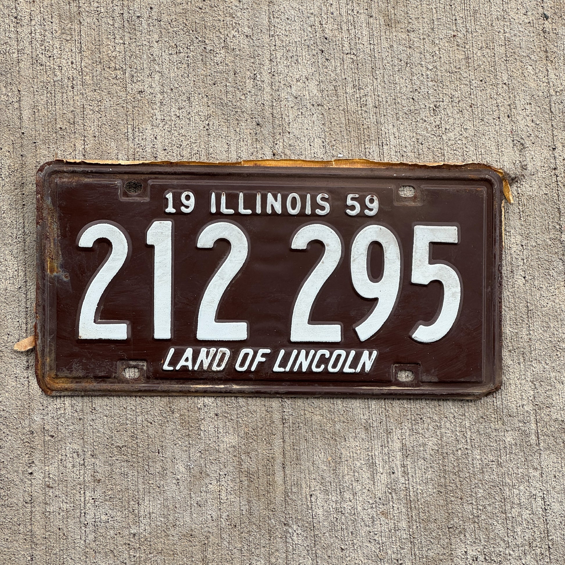 Photo of a 1959 Illinois License Plate Auto Tag Garage Decor Vintage 212 295 with original patina