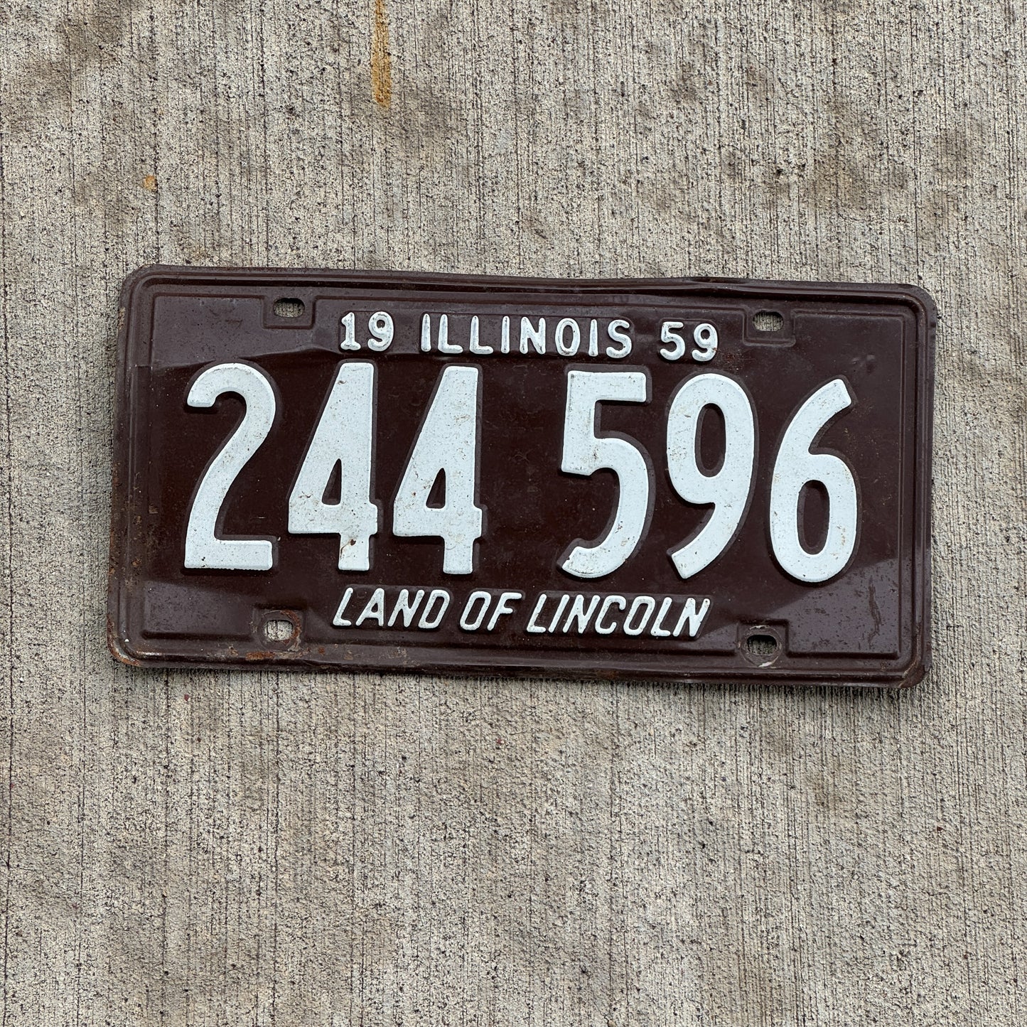 Photo of a 1959 Illinois License Plate Auto Tag Garage Decor Vintage 244 596 with original patina