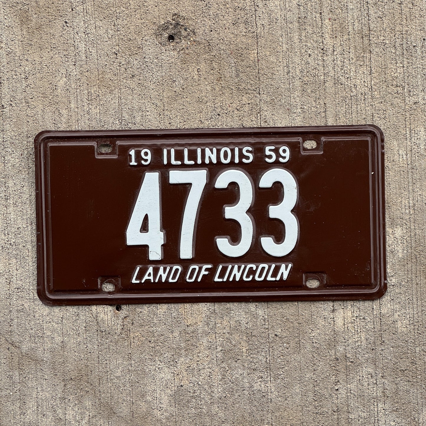 Photo of a 1959 Illinois License Plate Auto Tag Garage Decor Vintage Low Number Four Digit 4733 with original patina