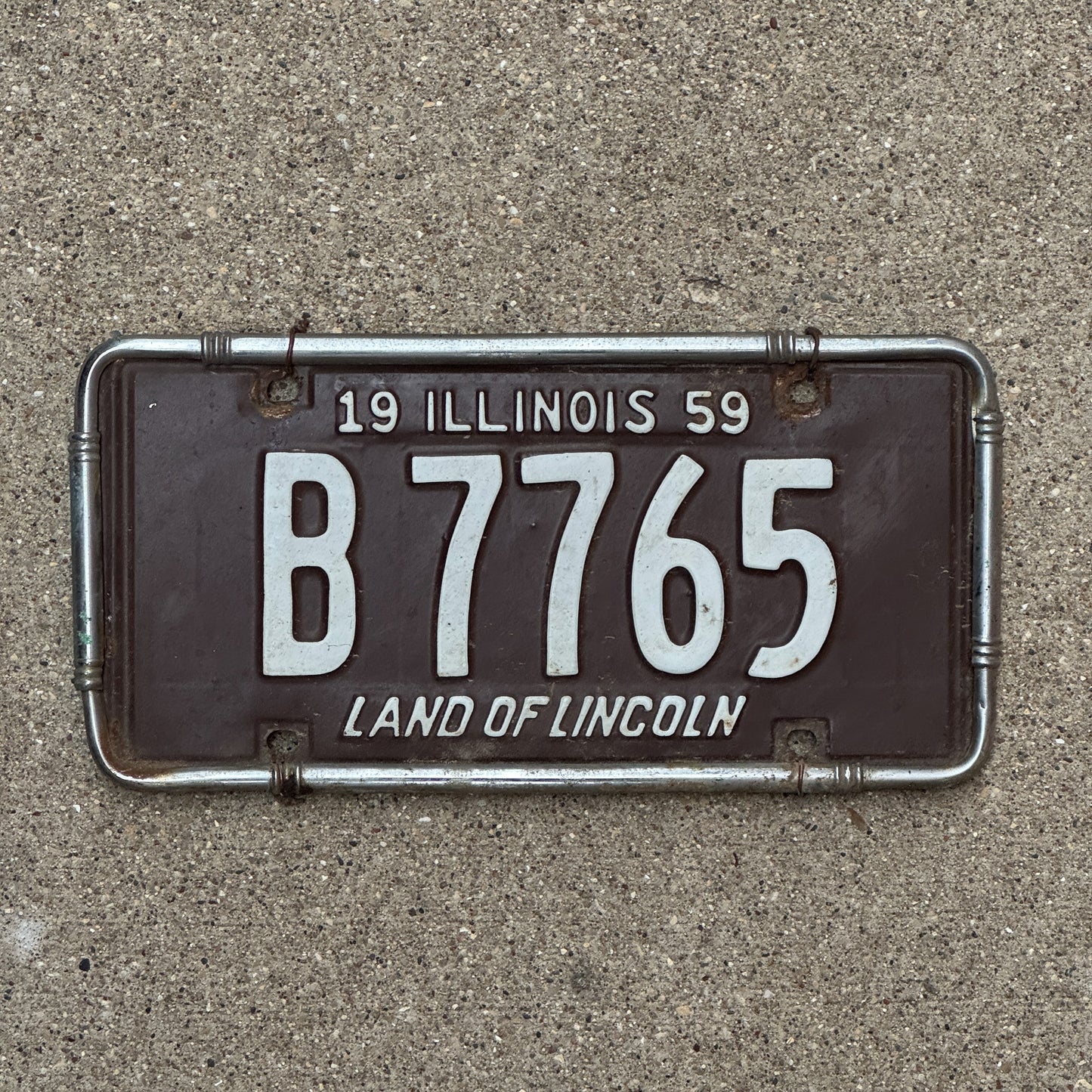 Photo of a 1959 Illinois Truck License Plate Auto Tag 1 Vintage Garage B 7765 with original patina