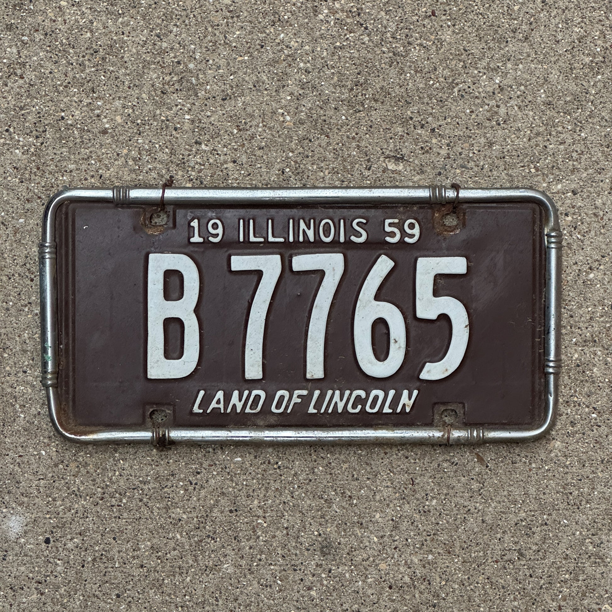 Photo of a 1959 Illinois Truck License Plate Auto Tag 1 Vintage Garage B 7765 with original patina
