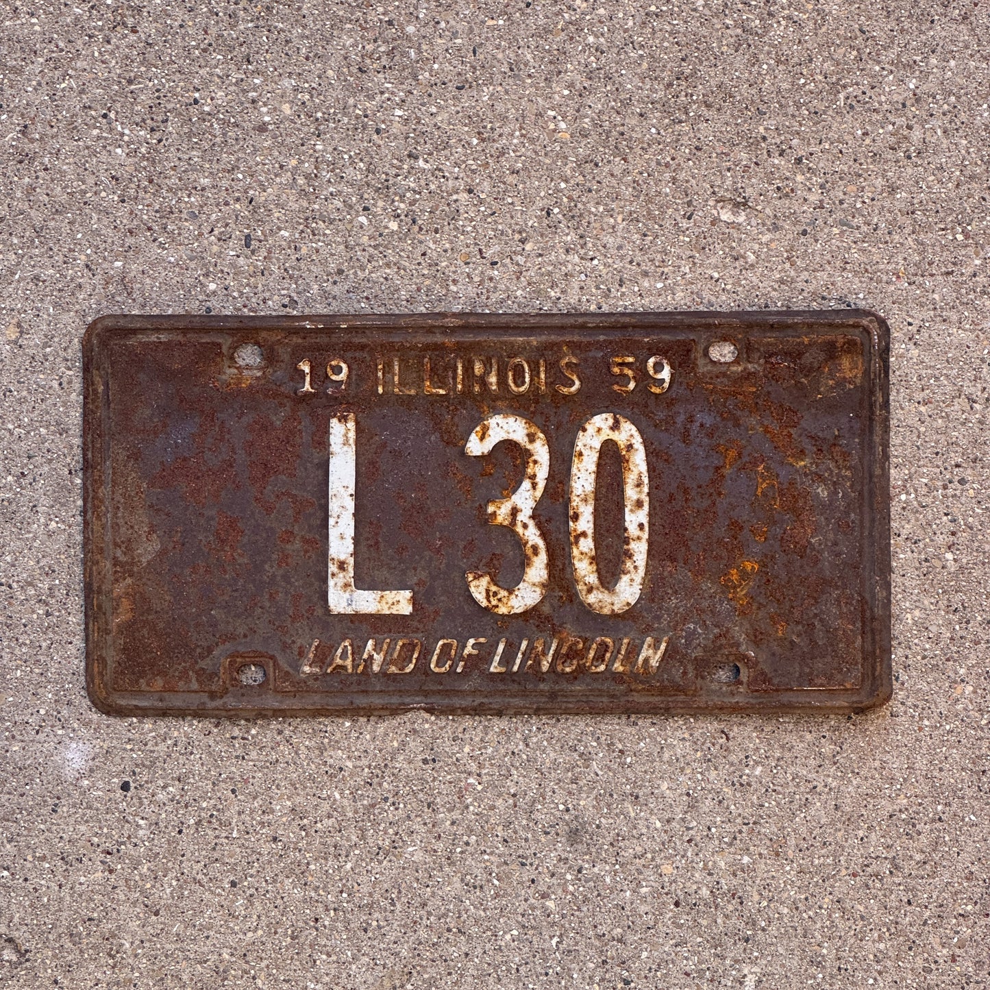 Photo of a 1959 Illinois Truck License Plate Auto Tag Garage Decor Vintage Low Number Two Digit L 30 with original patina