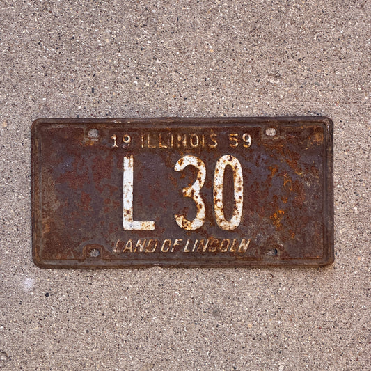 Photo of a 1959 Illinois Truck License Plate Auto Tag Garage Decor Vintage Low Number Two Digit L 30 with original patina