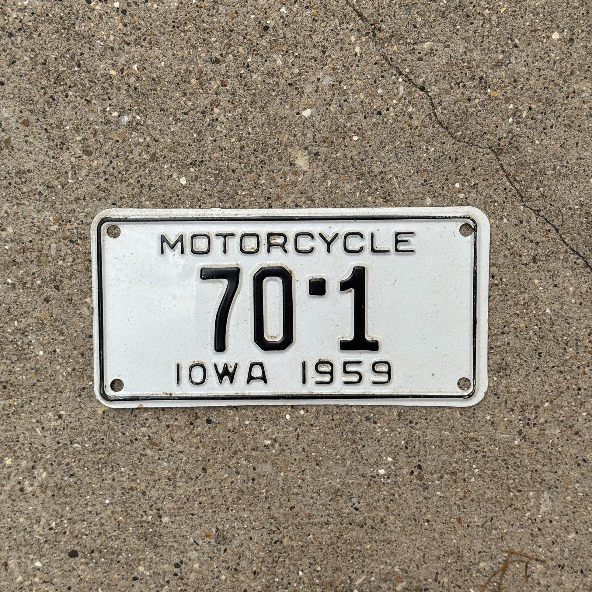 Photo of a 1959 Iowa Motorcycle License Plate Auto Tag Garage Decor Vintage Low Number Single Digit Muscatine County 70 1 with original patina