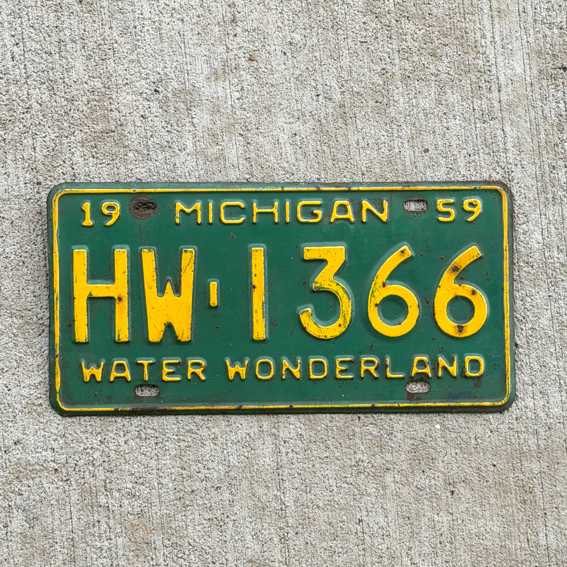 Photo of a 1959 Michigan License Plate Auto Tag Garage Decor Vintage HW 1366 with original patina