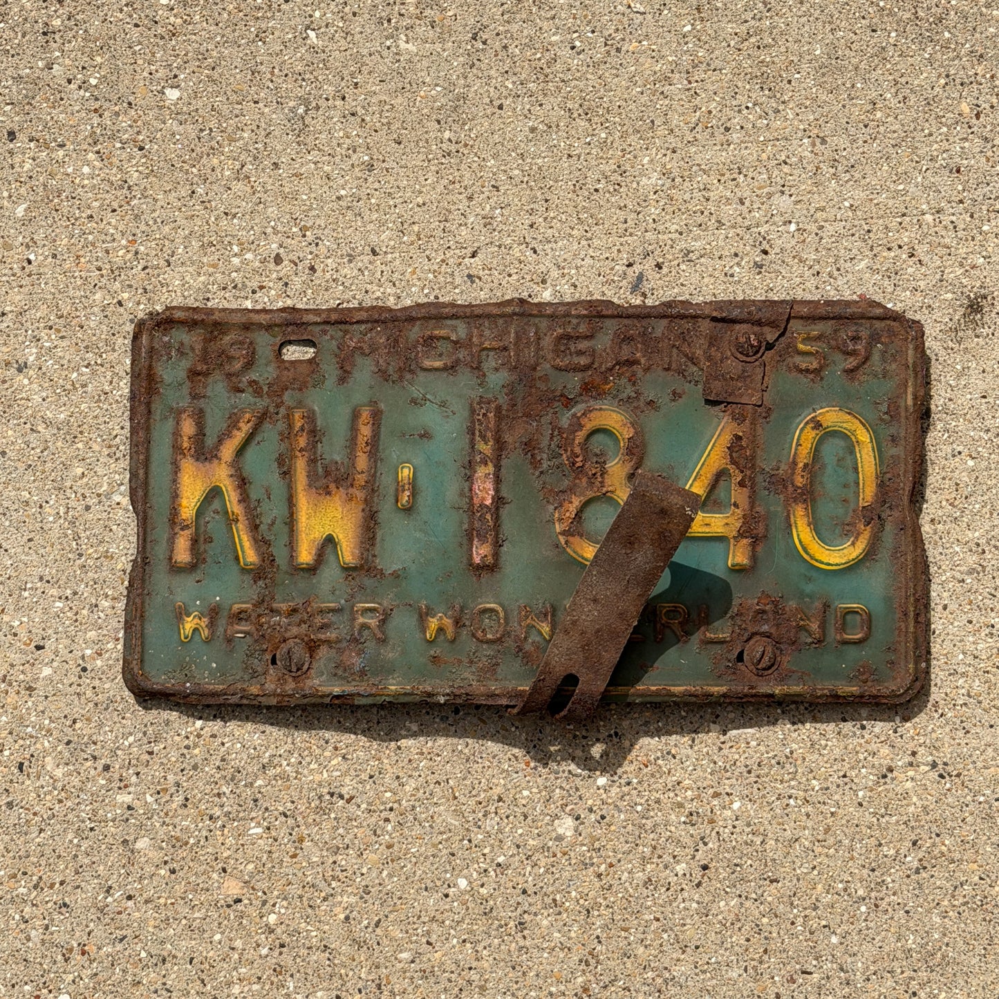 Photo of a 1959 Michigan License Plate Auto Tag Garage Decor Vintage KW 1840 with original patina