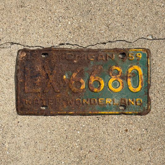 Photo of a 1959 Michigan License Plate Auto Tag Garage Decor Vintage LX 6680 with original patina