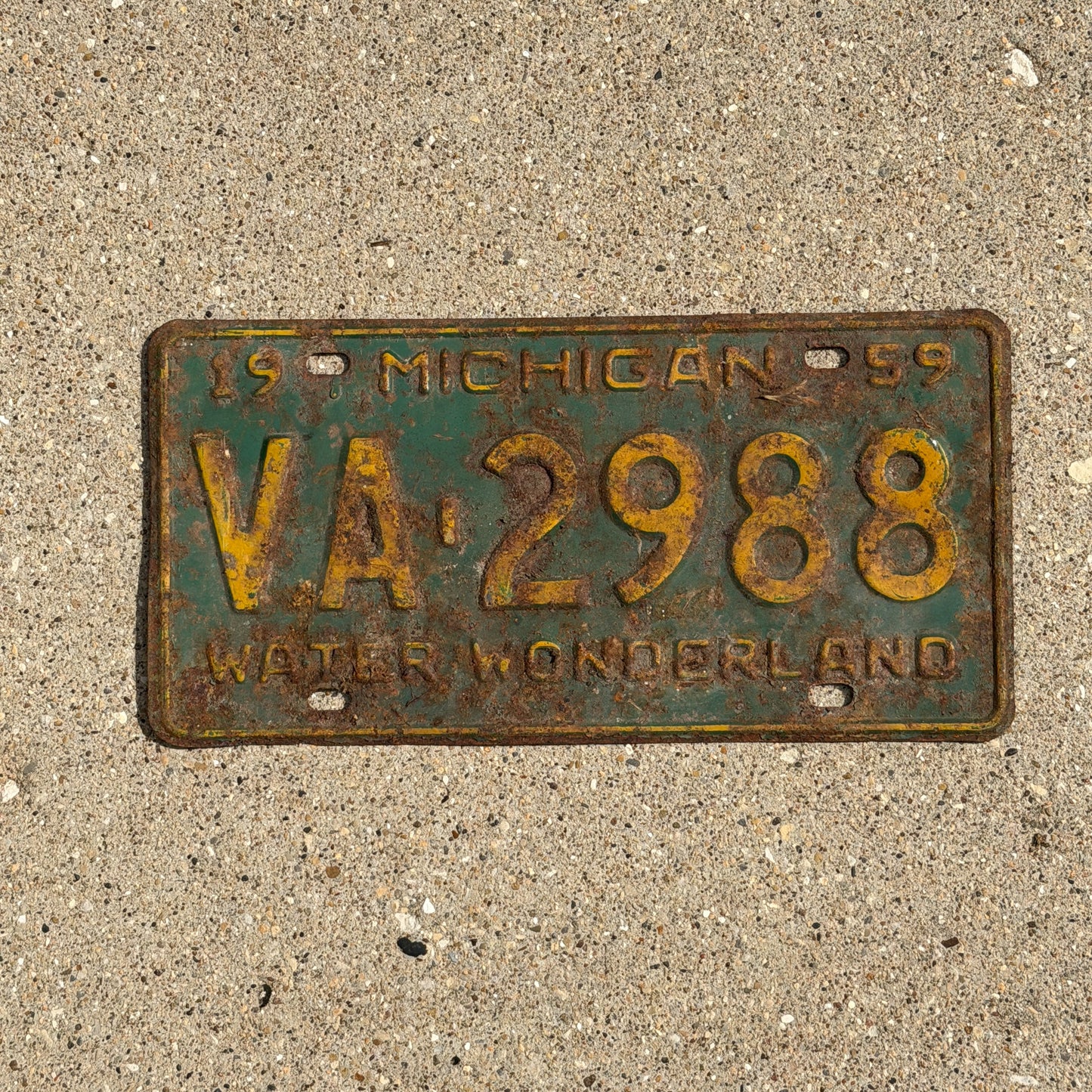 Photo of a 1959 Michigan License Plate Auto Tag Garage Decor Vintage VA 2988 with original patina