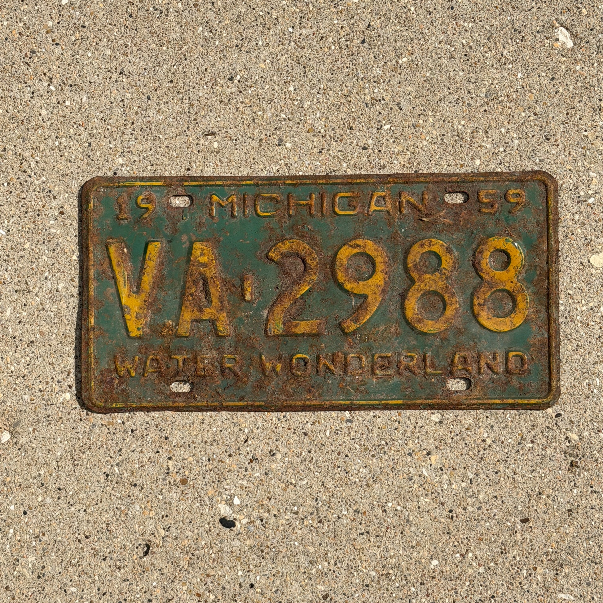 Photo of a 1959 Michigan License Plate Auto Tag Garage Decor Vintage VA 2988 with original patina