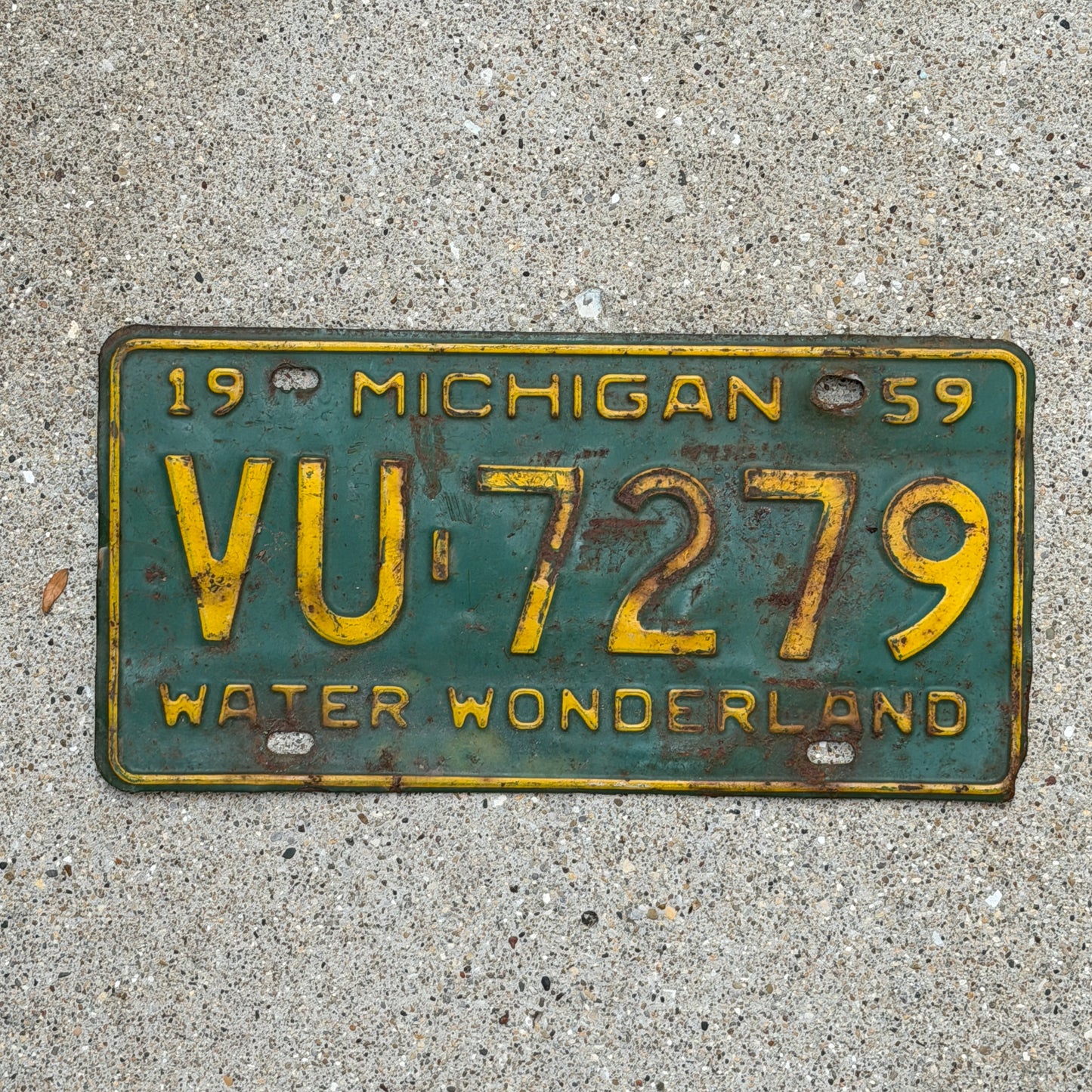 Photo of a 1959 Michigan License Plate Auto Tag Garage Decor Vintage VU 7279 with original patina